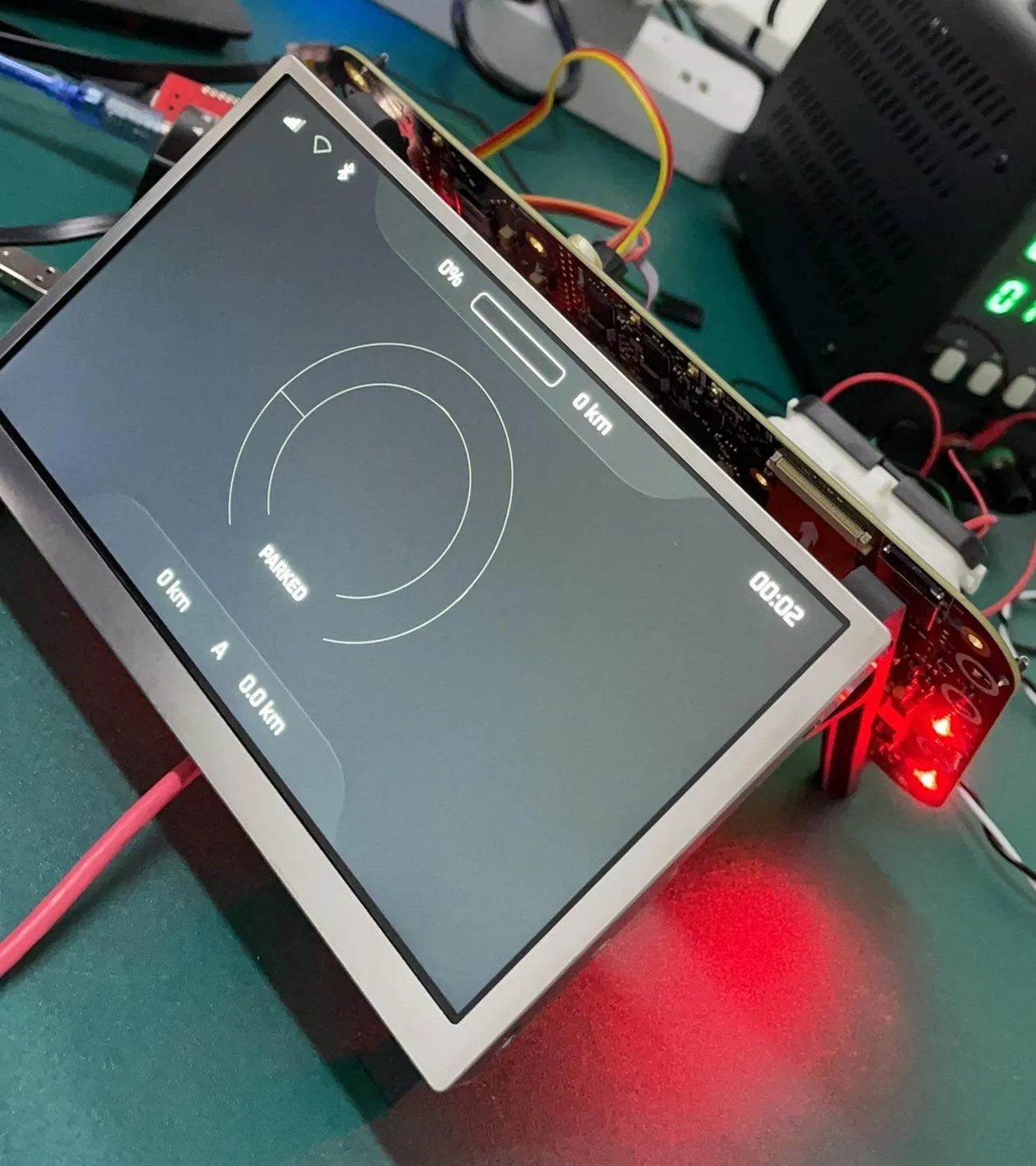 HMI bring-up rig with panel, carrier board and bench supply
